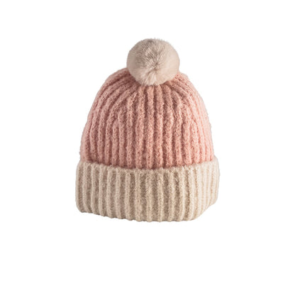 Trendy strikhue med kvast og foldekant